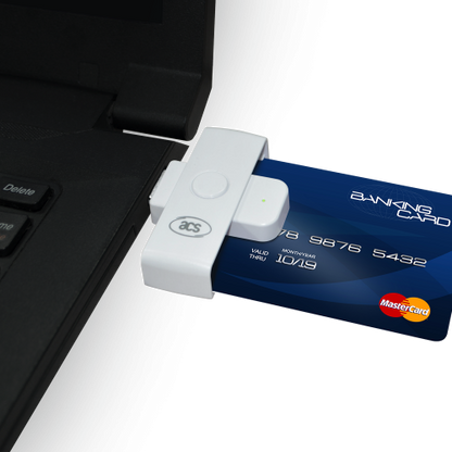 An USB-sized card reader with a smart card inserted, connected to a laptop